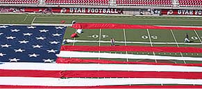 American Flags Flying Behind the tail of a Large Jet Plane