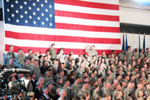 Soldiers with Really Big US Flag Behind Them